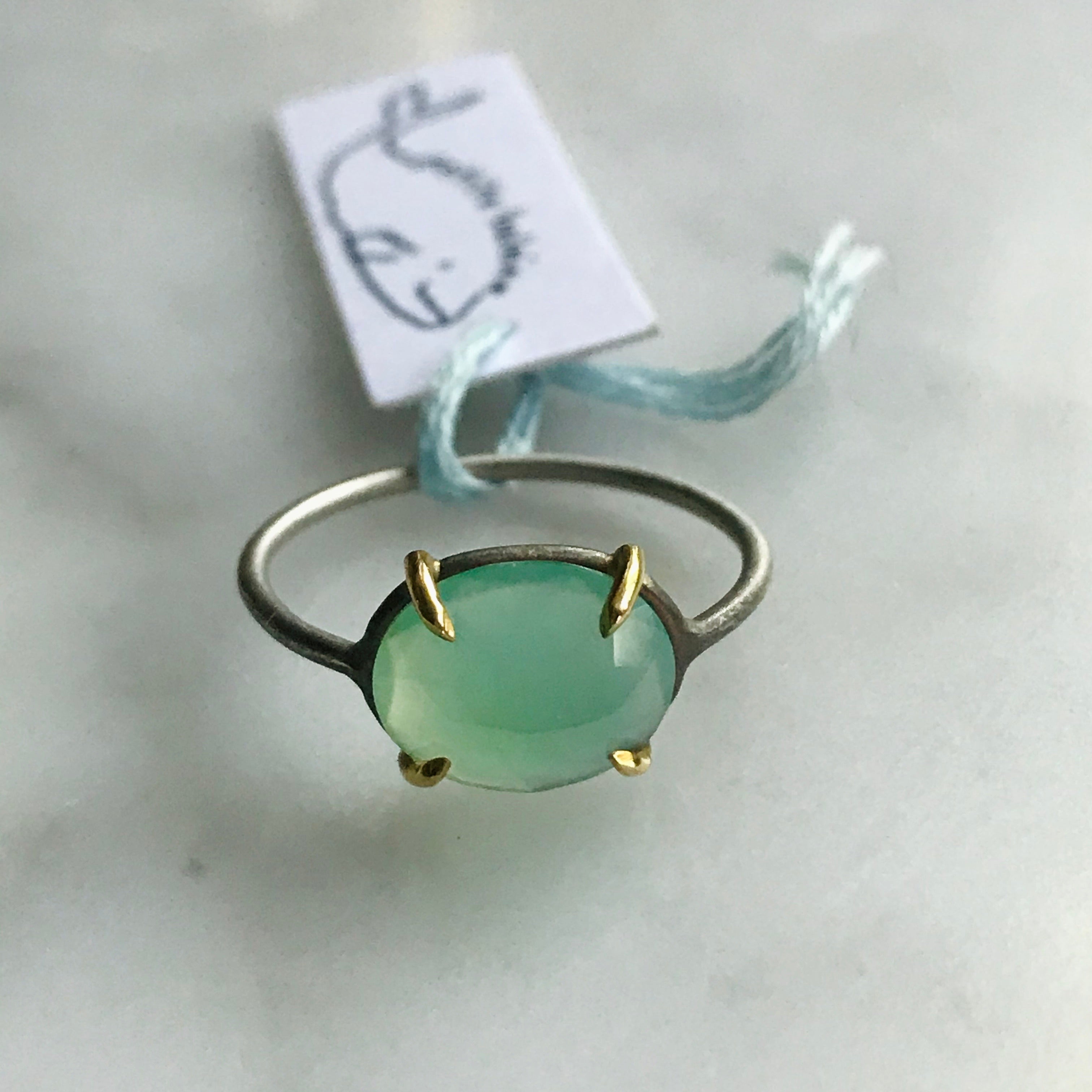 oval peruvian opal 18k gold prongs silver band