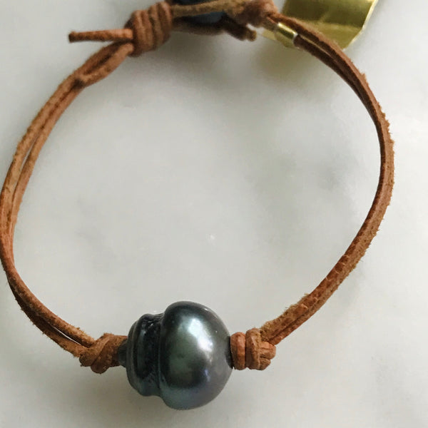 single pearl on leather bracelet