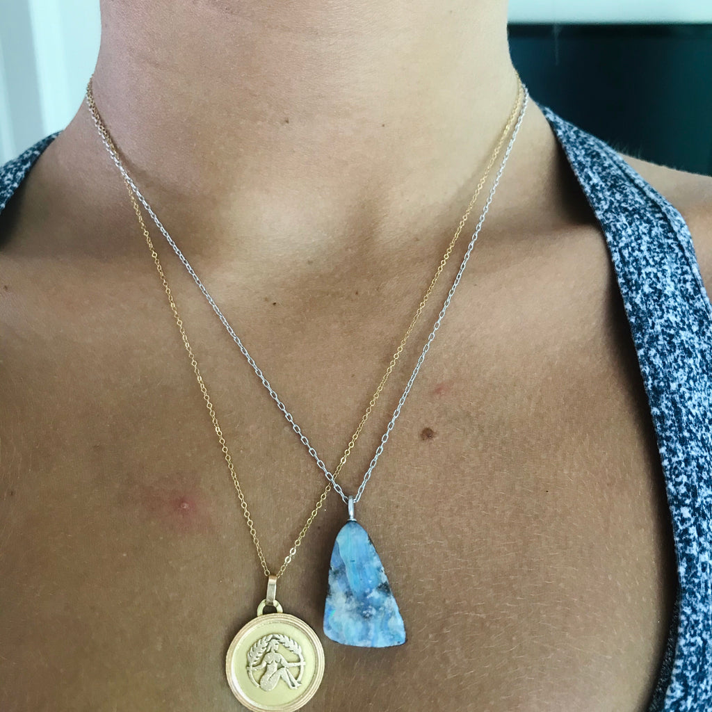triangle shaped boulder opal on an 18” 14k white gold chain