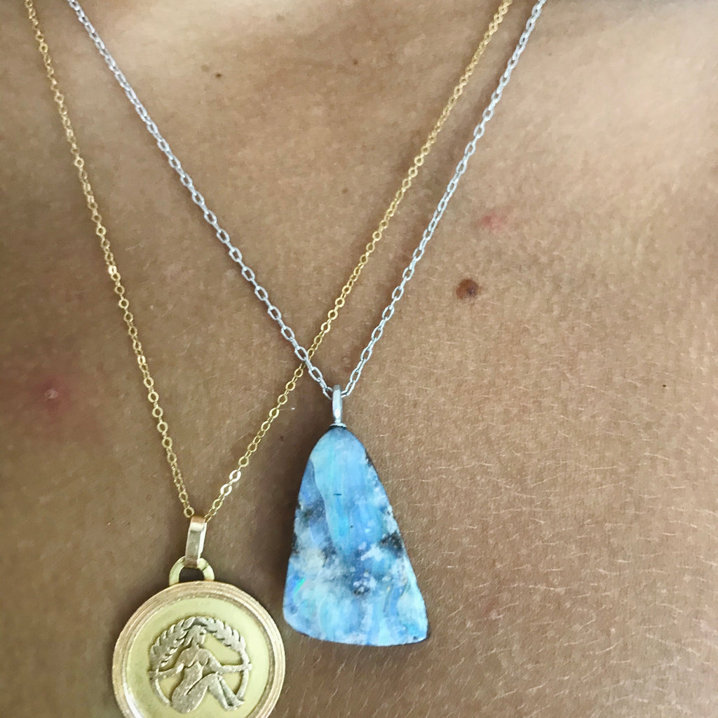 triangle shaped boulder opal on an 18” 14k white gold chain