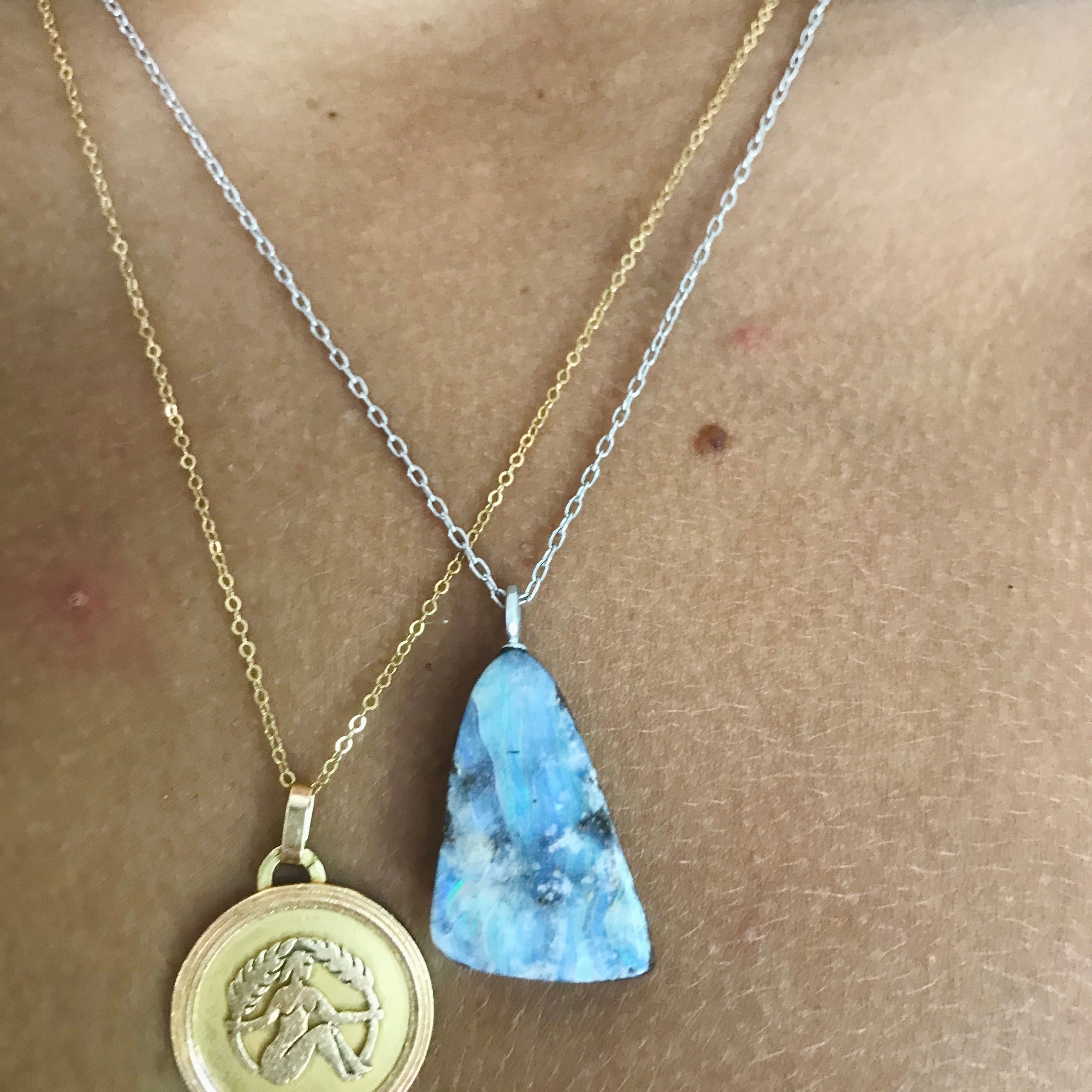 triangle shaped boulder opal on an 18” 14k white gold chain