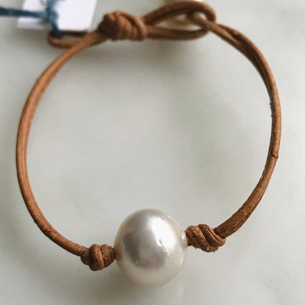 single pearl on leather bracelet
