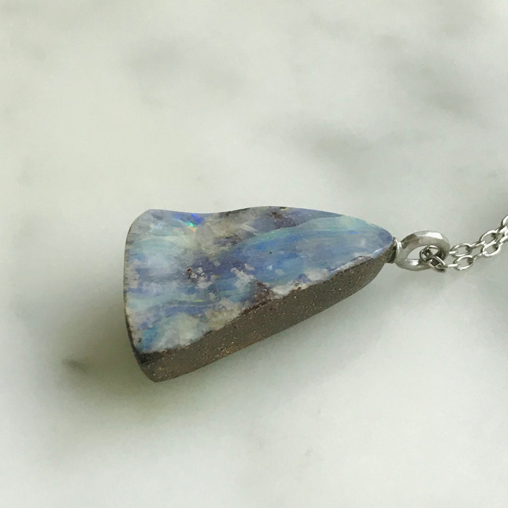 triangle shaped boulder opal on an 18” 14k white gold chain