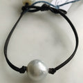 single pearl on leather bracelet