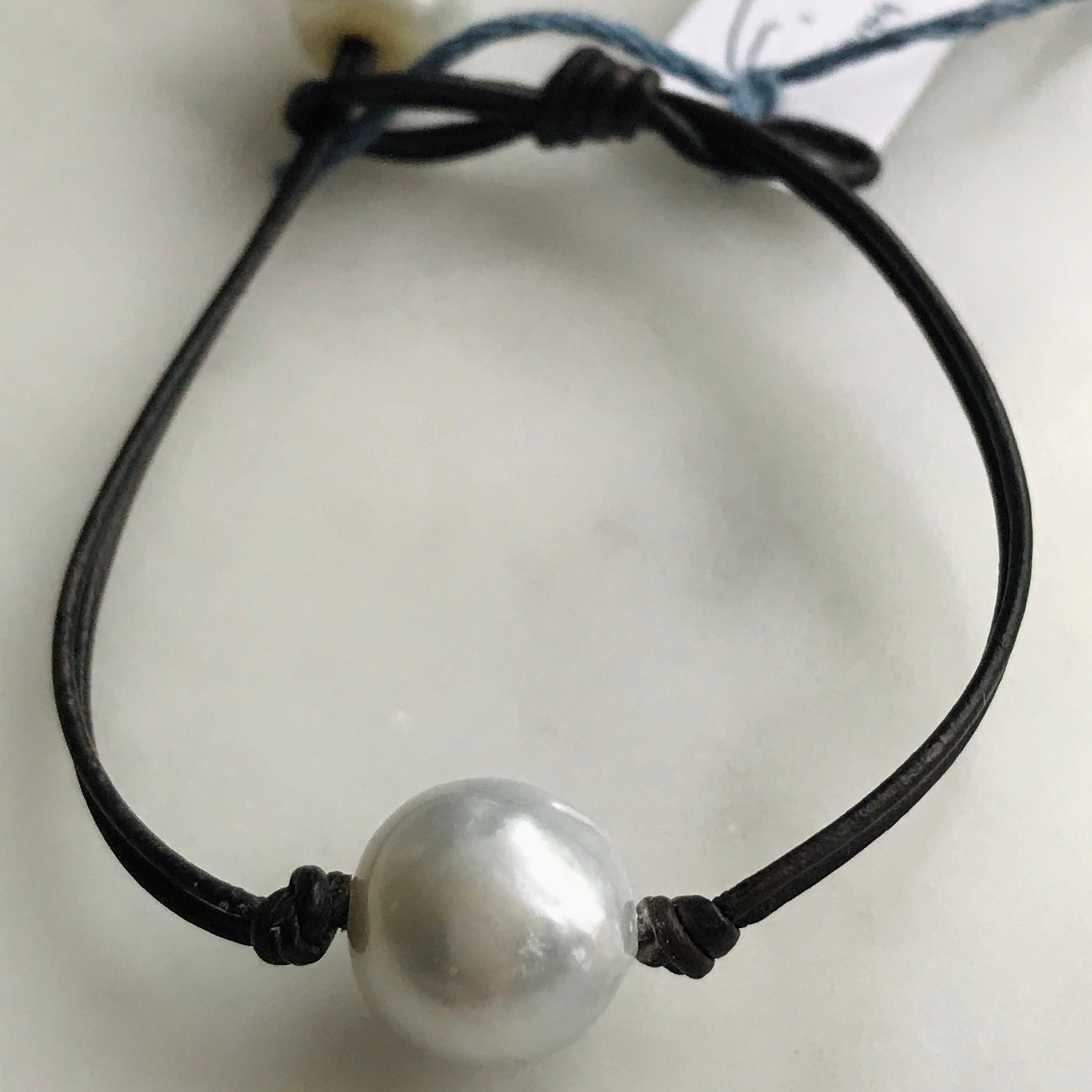 single pearl on leather bracelet