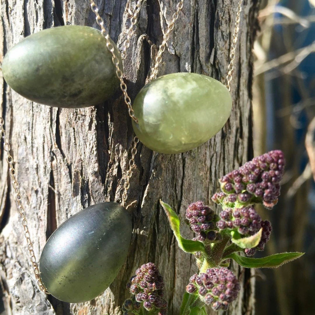 floating matte green garnet egg on 14k gold chain
