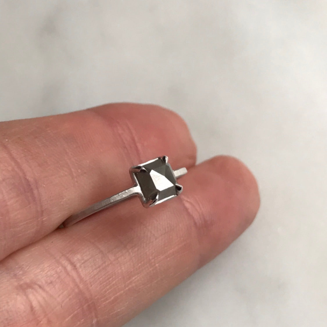 grey diamond set in 18k white gold