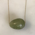 floating matte green garnet egg on 14k gold chain