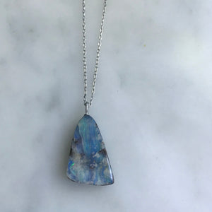 triangle shaped boulder opal on an 18” 14k white gold chain