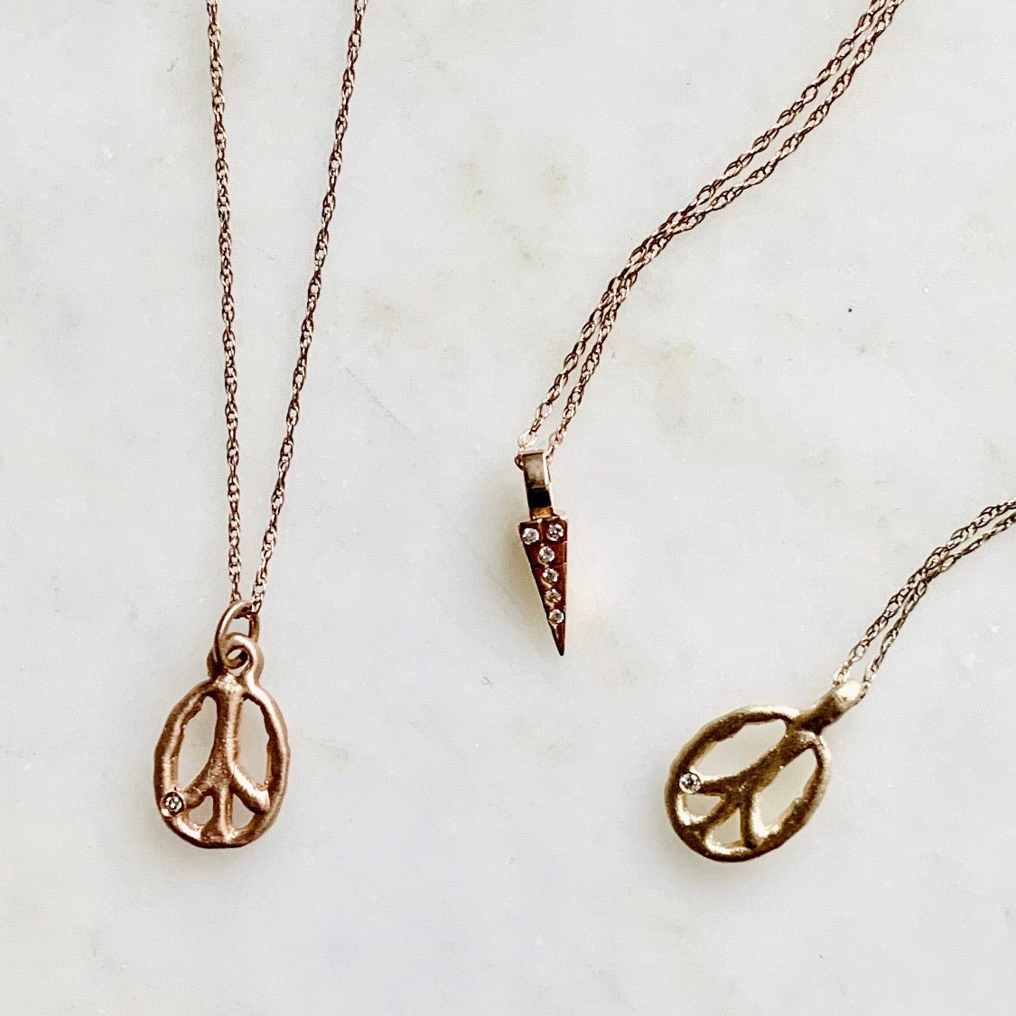 14k gold peace sign necklace with diamond